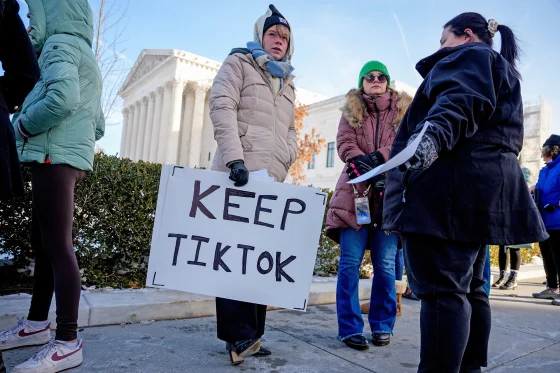 Sarah Baus of Charleston, S.C., holds a sign that reads "Keep TikTok" outside the Supreme Court on Friday.Andrew Harnik / Getty Images