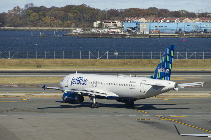 JetBlue Airbus A320-200 passenger aircraft spotted taxiing in LaGuardia airport LGA in New York City. The A320 airplane has the registration tail number N526JL, the name Blues Jsut Want to Have Fun and is powered by 2x IAE jet engines. Jet Blue Airways Corporation is a major airline in the United States with headquarters in Long Island City, Queens, NYC operating domestic and international network routes with a fleet of 286 planes. New York, USA on November 12, 2024 (Photo by Nicolas Economou/NurPhoto via Getty Images)