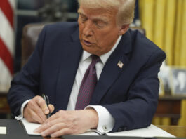 President Donald Trump signs an executive order on birthright citizenship in the Oval Office of the White House, Monday, Jan. 20, 2025, in Washington. (AP Photo/Evan Vucci)