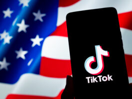 CHONGQING, CHINA - JANUARY 9, 2025 - A TikTok logo is displayed on a smartphone with the U.S. flag in the background in Chongqing, China, Jan. 9, 2025. (Photo credit should read CFOTO/Future Publishing via Getty Images)