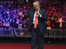 President-elect Donald Trump dances with The Village People at a rally ahead of the 60th Presidential Inauguration, Sunday, Jan. 19, 2025, in Washington. (AP Photo/Evan Vucci)