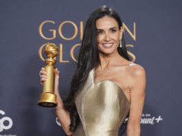 Demi Moore poses in the press room with the award for best performance by a female actor in a motion picture - musical or comedy for "The Substance" during the 82nd Golden Globes on Sunday, Jan. 5, 2025, at the Beverly Hilton in Beverly Hills, Calif. (AP Photo/Chris Pizzello)