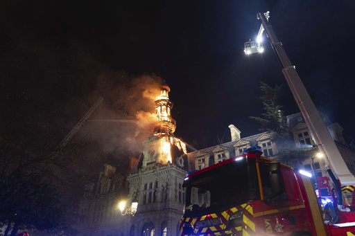 Blaze threatens the bell tower of a historic 19th-century town hall in Paris due to fire damage