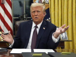 President Donald Trump talks to reporters as he signs executive orders in the Oval Office of the White House, Monday, Jan. 20, 2025, in Washington. (AP Photo/Evan Vucci)