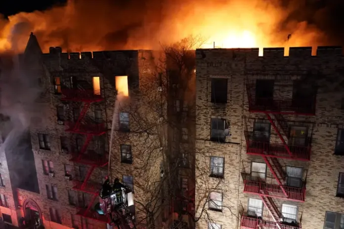 Nearly 200 New York firefighters are battling a massive five-alarm blaze at a Bronx apartment building Friday morning that has left at least seven people injured. Christopher Sadowski