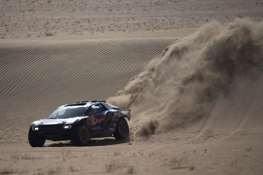 Defending champion Sainz flips in the dunes at Dakar Rally, trailing by an hour