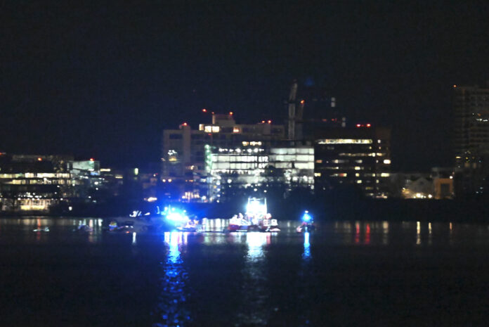 WASHINGTON DC, UNITED STATES - JANUARY 30: A view of the American Airlines plane in the water after it collided in midair with a military helicopter and crashed into the Potomac River in Washington, D.C. United States on January 30, 2025. 'A PSA Airlines Bombardier CRJ700 regional jet collided in midair with a Sikorsky H-60 helicopter while on approach to Runway 33 at Reagan Washington National Airport around 9 p.m. local time,' the Federal Aviation Administration (FAA) said in a statement. (Photo by Kyle Mazza/Anadolu via Getty Images)