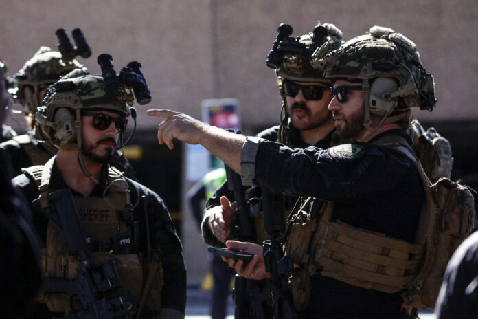 Local SWAT teams patrol outside the Ceasars Superdome ahead of the Sugar Bowl NCAA College Football Playoff game, Thursday, Jan. 2, 2025, in New Orleans. (AP Photo/Butch Dill)