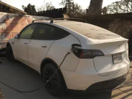 A Tesla car with its charger still attached sits in the driveway of building destroyed by the Eaton Fire, in Altadena, Calif., Friday, Jan. 10, 2025. Photo by AP Photo/Jae C. Hong