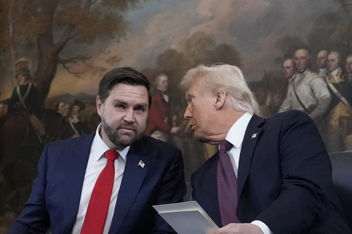 Donald Trump speaks with JD Vance, left, before taking their oaths of office during the Inauguration ceremonies in the Rotunda of the U.S. Capitol in Washington on Monday, Jan. 20, 2025. (AP Photo/Morry Gash, Pool)