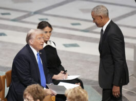 President-elect Donald Trump and Melania Trump watch as former President Barack Obama arrives before the state funeral for former President Jimmy Carter at Washington National Cathedral in Washington, Thursday, Jan. 9, 2025. (AP Photo/Jacquelyn Martin)