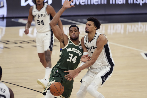 Wembanyama scores 30 points, grabs 14 rebounds, and records 6 blocks in Spurs’ 144-118 victory over Antetokounmpo and the Bucks.