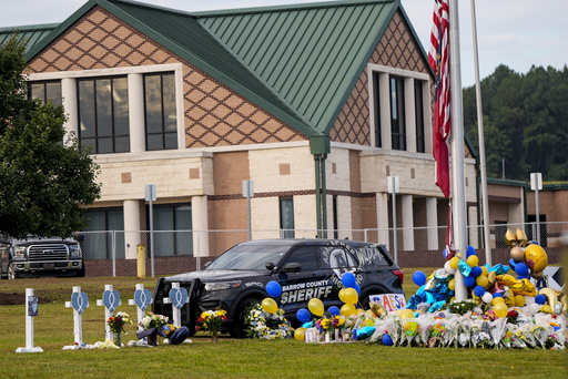 A 14-year-old apprehended with a firearm at Apalachee High School in Georgia following a fatal shooting incident.