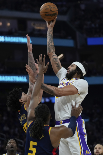 Davis and James propel Lakers to 118-108 win against Warriors with Curry failing to score in the second half.