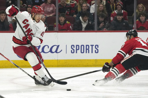 Aho nets overtime goal, leading the Hurricanes to a 4-3 victory over the Blackhawks