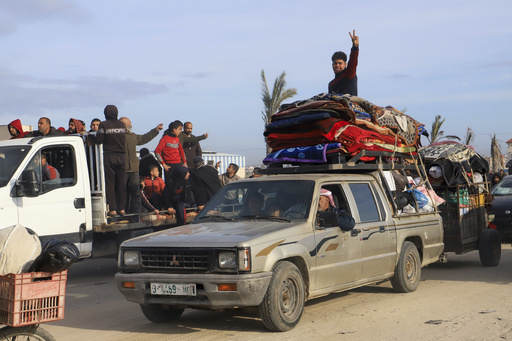 Palestinians navigate debris to reach their residences as the Gaza truce begins.