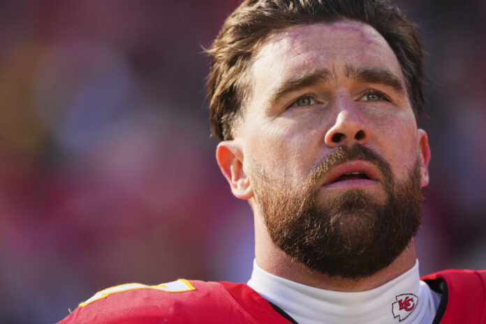 KANSAS CITY, MO - DECEMBER 21: Travis Kelce #87 of the Kansas City Chiefs looks on before kickoff against the Houston Texans during an NFL football game at GEHA Field at Arrowhead Stadium on December 21, 2024 in Kansas City, Missouri. (Photo by Cooper Neill/Getty Images)