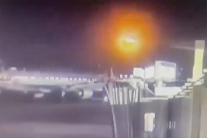 Footage from a security camera at Ronald Reagan Washington National Airport in Arlington, Va., shows an American Airlines jet colliding with an Army helicopter during landing, Wednesday, Jan. 29, 2025. (Ronald Reagan Washington National Airport via AP)