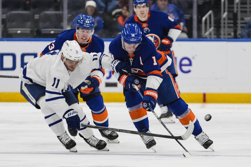 Maple Leafs secure 2-1 victory against Islanders with strong performances from McMann and Woll