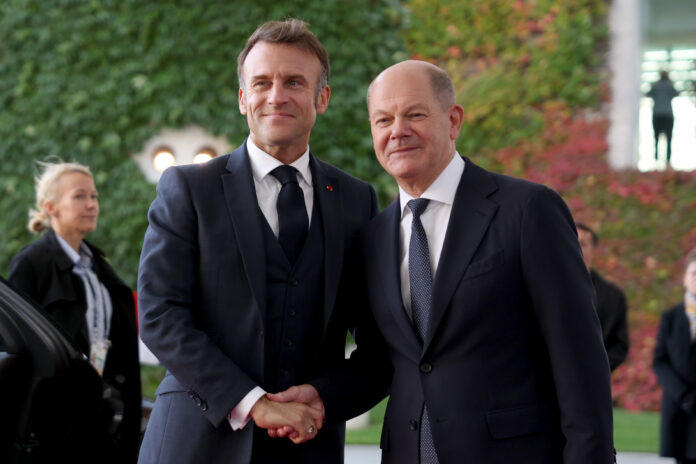 BERLIN, GERMANY - OCTOBER 18: German Chancellor Olaf Scholz greets French President Emmanuel Macron at the Chancellery on October 18, 2024 in Berlin, Germany. U.S. President Joe Biden is visiting Berlin to meet with Scholz, British Prime Minister Keir Starmer and French President Emmanuel Macron. (Photo by Maja Hitij/Getty Images)