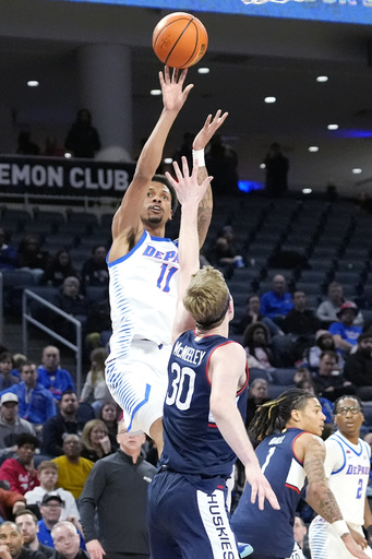 Liam McNeeley exits UConn’s victory against DePaul due to right ankle injury.