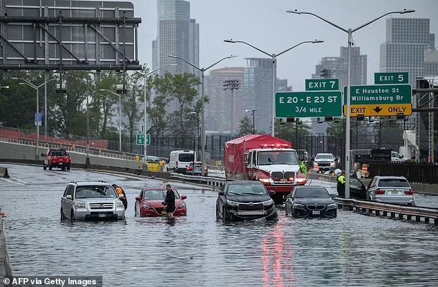 The researchers took a 'fusion' approach to their estimates by integrating statistical methods with expert judgments to offer a clearer, more reliable picture of future sea level rise. Pictured is Manhattan, New York after heavy rains in September, 2023 

