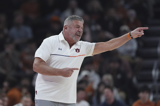 Auburn edges past Texas 87-82 to secure school-record win for coach Bruce Pearl.