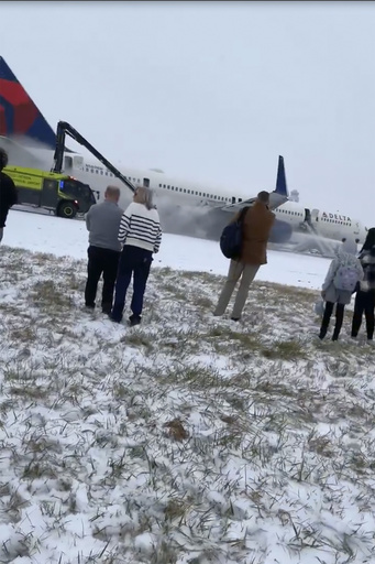 Delta flight halts takeoff at snowy Atlanta airport due to engine issues.