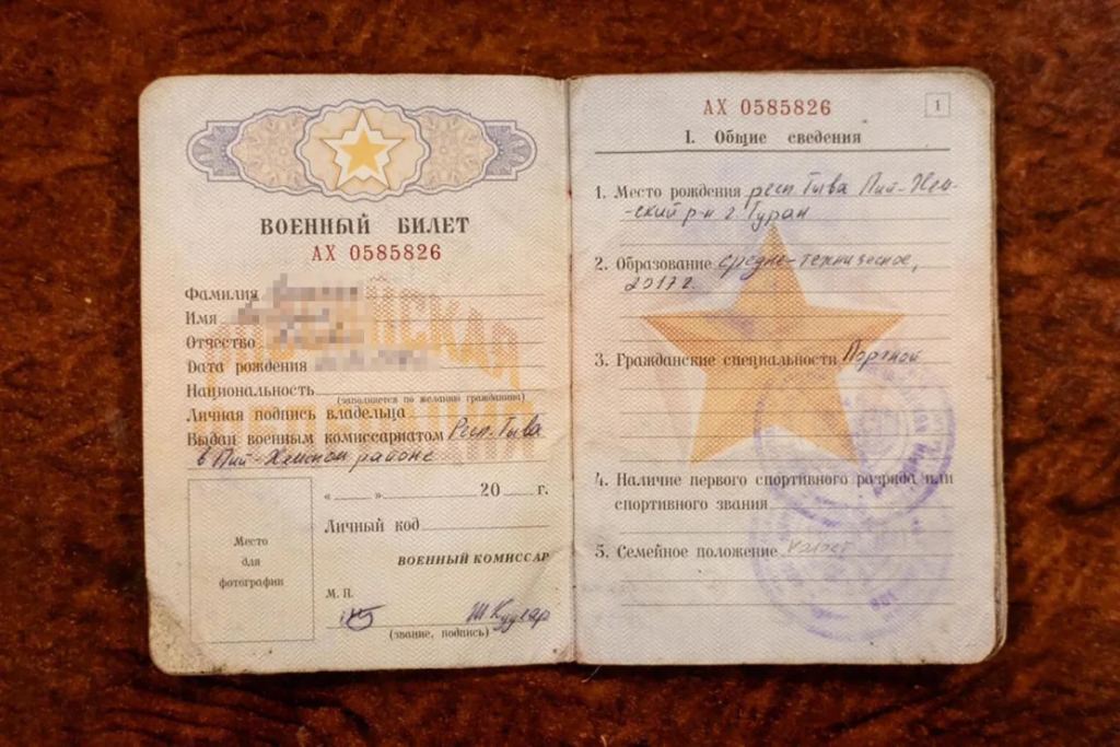 A video and still photograph show a Russian military ID which Ukraine claims was carried by a North Korean soldier taken captive by Ukrainian forces. CNN has blurred the name and date of birth on the ID. Security Service of Ukraine