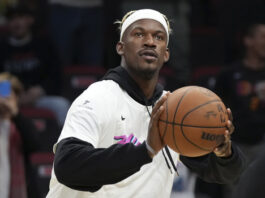 Miami Heat forward Jimmy Butler warms up before an NBA basketball game against the Denver Nuggets, Friday, Jan. 17, 2025, in Miami. (AP Photo/Lynne Sladky)