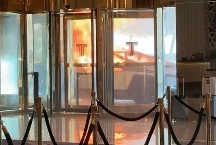 A Tesla Cybertruck burns in front of the Trump Hotel in Las Vegas