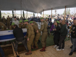 Israeli soldiers and relatives carry the flag-draped casket of Sergeant Yahav Maayan, who was killed in combat in the Gaza Strip, during his funeral at a military cemetery in Modiin, Israel, Sunday, Jan. 12, 2025. (AP Photo/Ohad Zwigenberg)