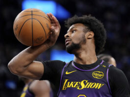 Los Angeles Lakers guard Bronny James grabs the ball after the Los Angeles Clippers scored during the second half of an NBA basketball game, Sunday, Jan. 19, 2025, in Inglewood, Calif. (AP Photo/Mark J. Terrill)