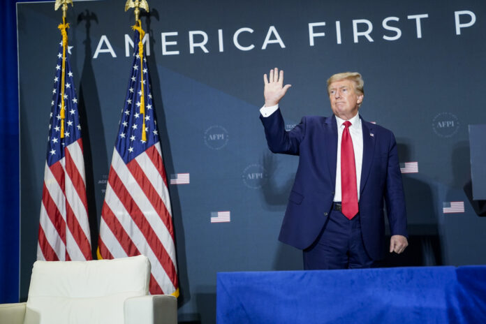 Washington, DC - July 26 : Former President Donald Trump departs the stage after speaking during the America First Agenda Summit organized by America First Policy Institute AFPI on Tuesday, July 26, 2022 in Washington, DC. (Photo by Jabin Botsford/The Washington Post via Getty Images)