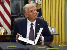 President Donald Trump signs executive orders in the Oval Office of the White House, Monday, Jan. 20, 2025, in Washington. (AP Photo/Evan Vucci)