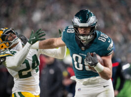 PHILADELPHIA, PA - JANUARY 12: Philadelphia Eagles tight end Dallas Goedert (88) scores a touchdown after stiff arming Green Bay Packers cornerback Carrington Valentine (24) during the NFC Wild Card playoff game between the Green Bay Packers and the Philadelphia Eagles on January 12th, 2025 at Lincoln Financial Field in Philadelphia, PA. (Photo by Terence Lewis/Icon Sportswire via Getty Images)