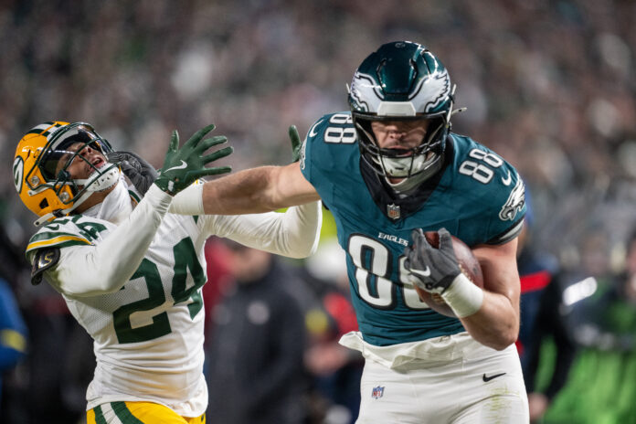 PHILADELPHIA, PA - JANUARY 12: Philadelphia Eagles tight end Dallas Goedert (88) scores a touchdown after stiff arming Green Bay Packers cornerback Carrington Valentine (24) during the NFC Wild Card playoff game between the Green Bay Packers and the Philadelphia Eagles on January 12th, 2025 at Lincoln Financial Field in Philadelphia, PA. (Photo by Terence Lewis/Icon Sportswire via Getty Images)