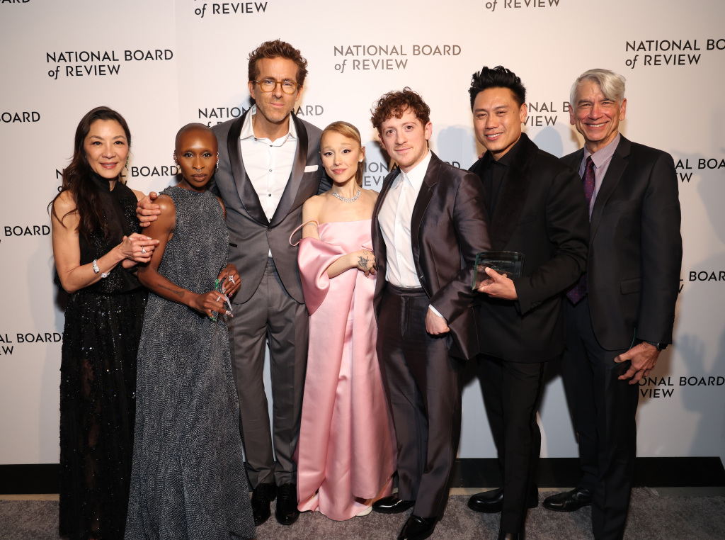 NEW YORK, NEW YORK - JANUARY 07: Michelle Yeoh, Cynthia Erivo, Ariana Grande, Ethan Slater, Jon M. Chu and David Nicksay winners of the Best Film Award for "Wicked," and Ryan Reynolds pose during The National Board of Review Annual Awards Gala at Cipriani 42nd Street on January 07, 2025 in New York City. (Photo by Kevin Mazur/Getty Images for National Board of Review)