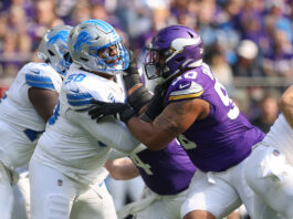 MINNEAPOLIS, MN - OCTOBER 20: Minnesota Vikings defensive end Jonathan Bullard (90) rushes while being blocked by Detroit Lions offensive tackle Penei Sewell (58) during the NFL game between the Detroit Lions and the Minnesota Vikings on October 20, 2024, at U.S. Bank Stadium in Minneapolis, MN. (Photo by Bailey Hillesheim/Icon Sportswire via Getty Images)