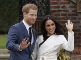 FILE -Britain's Prince Harry and his fiancee Meghan Markle pose for photographers during a photocall in the grounds of Kensington Palace in London, Nov. 27, 2017. (AP Photo/Matt Dunham, File)