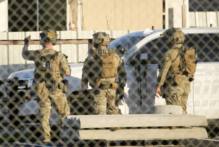 FILE - FBI and Harris County Sheriff's SWAT members work, Wednesday, Jan. 1, 2025, near Crescent Peak Drive in Houston, where a police investigation continues into a property associated with Shamsud-Din Jabbar, who has been identified as the attacker in the New Orleans massacre. (Melissa Phillip/Houston Chronicle via AP, File)