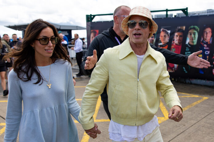 NORTHAMPTON, ENGLAND - JULY 7: Actor Brad Pitt and girlfriend Ines De Ramon walk in the paddock during the F1 Grand Prix of Great Britain at Silverstone Circuit on July 7, 2024 in Northampton, United Kingdom. (Photo by Kym Illman/Getty Images)