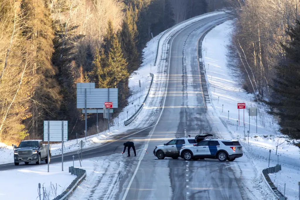 A Border Patrol agent sets up flares on I-91 near the scene of the shooting.
REUTERS/Carlos Osorio