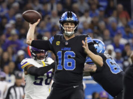 Detroit Lions quarterback Jared Goff (16) throws against the Minnesota Vikings during the first half of an NFL football game Sunday, Jan. 5, 2025, in Detroit. (AP Photo/Rey Del Rio)