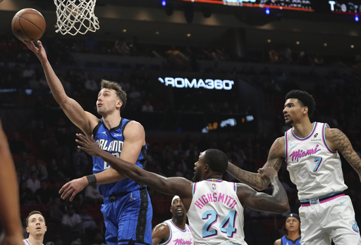 Heat secure victory over Magic 125-119 in double overtime as Herro scores 30 points without Butler.