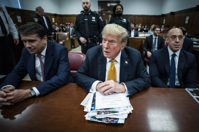 New York, NY - May 29 : Former President Donald Trump, flanked by attorneys Todd Blanche and Emil Bove, arrives for his criminal trial at the Manhattan Criminal Court in New York, NY on Wednesday, May 29, 2024. Trump was charged with 34 counts of falsifying business records last year, which prosecutors say was an effort to hide a potential sex scandal, both before and after the 2016 presidential election. Trump is the first former U.S. president to face trial on criminal charges. (Photo by Jabin Botsford/The Washington Post via Getty Images)