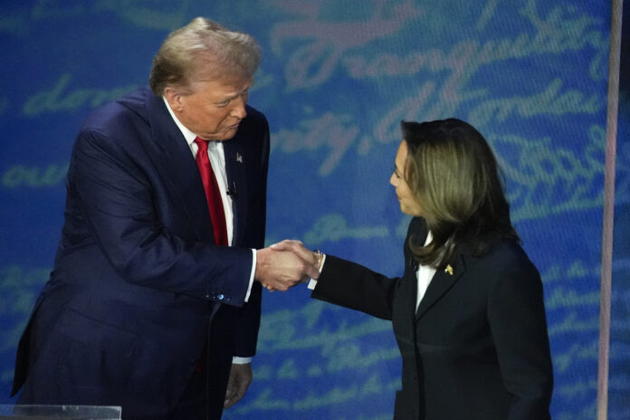 FILE - Republican presidential nominee former President Donald Trump, left, and Democratic presidential nominee Vice President Kamala Harris shake hands before the start of an ABC News presidential debate, Sept. 10, 2024, in Philadelphia. (AP Photo/Alex Brandon, File)