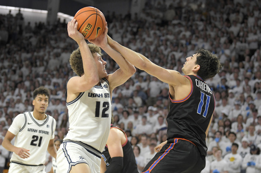 With just 7 seconds remaining, Martinez’s 4-point play propels No. 25 Utah State to an 81-79 comeback victory over Boise State.