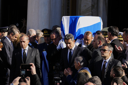 Greeks honor ex-Prime Minister Costas Simitis during his official funeral service.