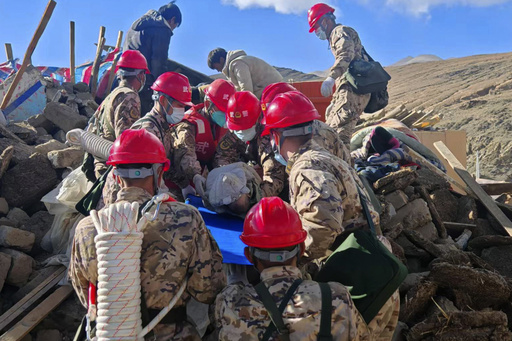 In this photo released by Xinhua News Agency, first responders perform rescue work at a village in Changsuo Township of Dingri County in Xigaze, southwest China's Tibet Autonomous Region, Jan. 7, 2025 (Hu Zikui/Xinhua via AP)